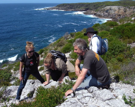 Trainees looking at plants, Jervis Bay